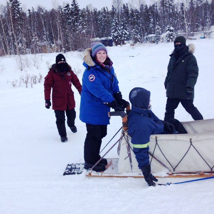 Emily Van Koeveringe on a dog sled