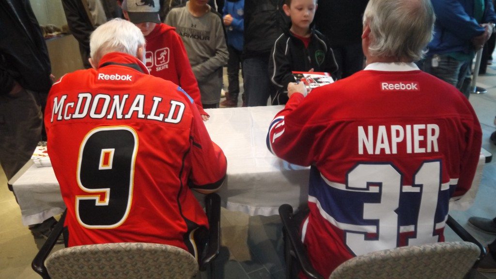 McDonald and Napier signing autographs