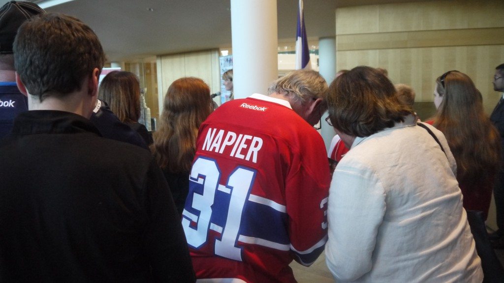 Napier signing autographs while Lanny speaks