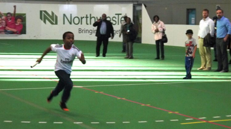 A boy runs during a fun the 4×100-meter race.