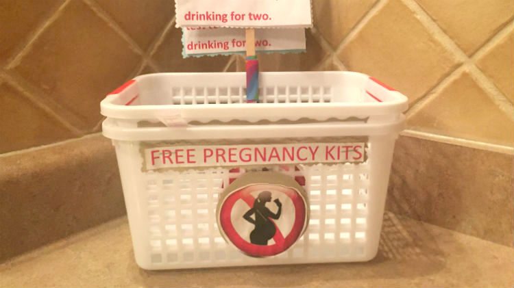 An empty bin where pregnancy kits were made available inside the women's restroom at Twist.