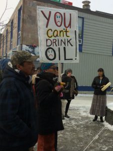 Ralliers held signs reading "Honour the treaties", "Water is life" and "You can't drink oil." Photo courtesy: Jess Dunkin on Twitter.
